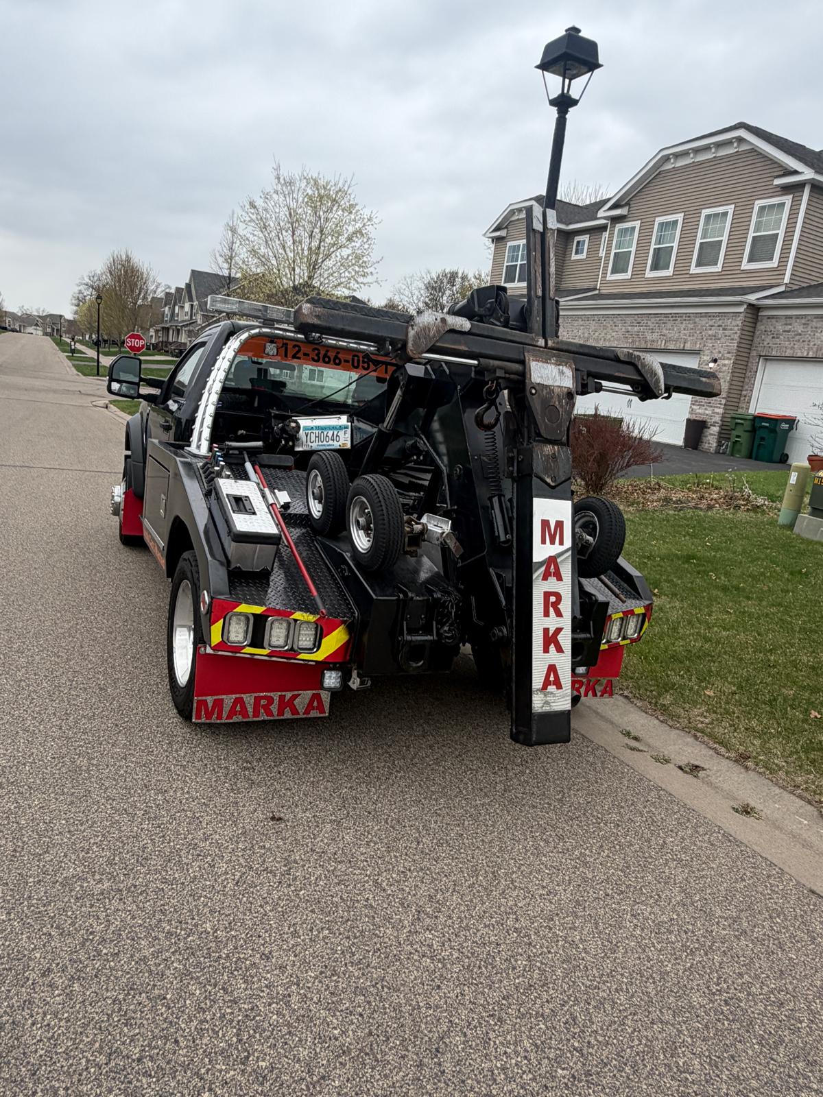 Marka Towing black wrecker rear view